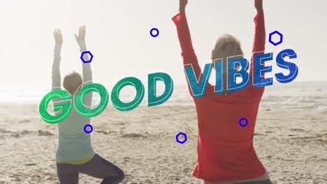 Animation-of-text-good-vibes,-in-blue-and-green,-with-senior-women-doing-yoga-on-beach