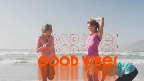 Animation-of-text-good-vibes,-in-orange,-over-women-exercising-on-beach