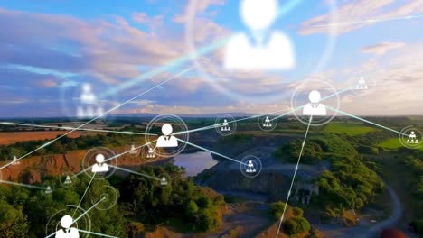 Animation-of-networks-of-connections-with-icons-over-countryside-landscape
