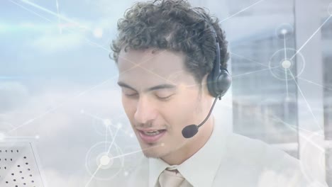 Animation-of-network-of-connections-with-globe-over-businessman-using-phone-headset