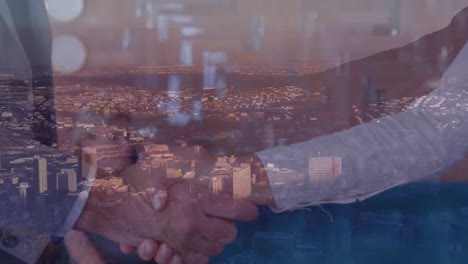 Animation-of-businessman-handshake-over-cityscape