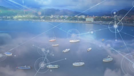 Animation-of-moving-network-of-connections,-over-beautiful-coastal-landscape