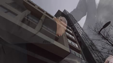 Animation-of-businessman-handshake-and-cityscape