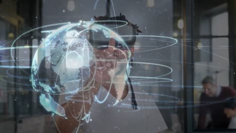 Animation-of-globe-of-network-of-connections-over-man-wearing-vr-headset