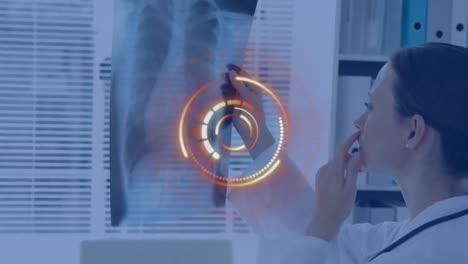 Animation-of-scope-scanning-over-female-doctor-holding-x-ray-photograph