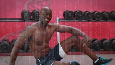 Animation-of-dna-strand-over-african-american-man-at-gym