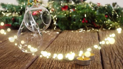 Animation-of-string-lights-and-blurred-christmas-tree-decorations