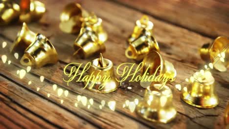 Animation-of-text,-happy-holidays,-in-yellow,-over-string-lights-and-christmas-bell-decorations