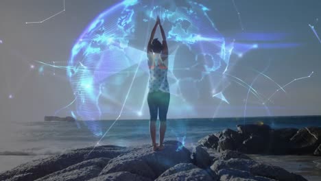Animation-of-globe-over-woman-practicing-doing-yoga