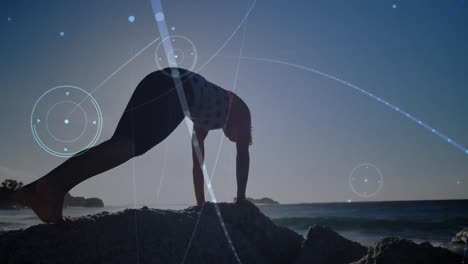 Animation-of-globe-over-woman-practicing-doing-yoga