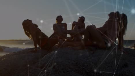 Animation-of-networks-of-connections-over-happy-group-of-friends-having-at-the-beach