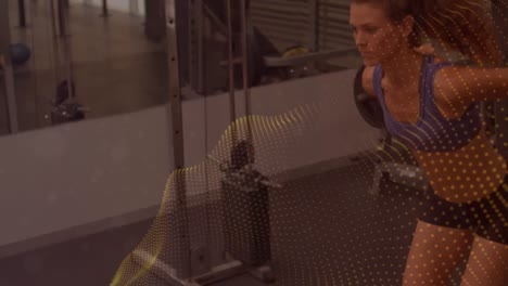 Animation-of-moving-spots-over-fit-woman-exercising-in-gym