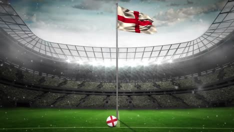Animation-of-snow-falling-over-flag-of-england-at-sports-stadium