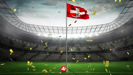 Animation-of-gold-confetti-falling-over-flag-of-switzerland-at-sports-stadium