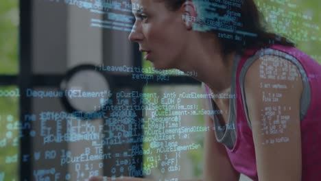 Animation-of-data-processing-over-woman-exercising-in-gym