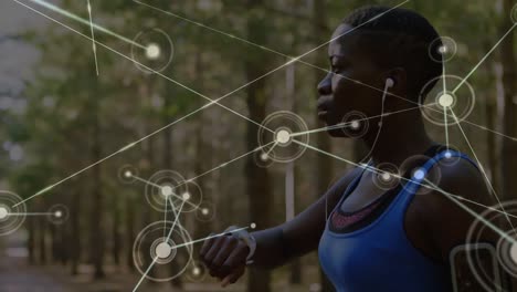 Animation-of-network-of-connections-over-woman-exercising-in-forest