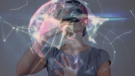 Animation-Der-Digitalen-Schnittstelle-über-Einer-Geschäftsfrau,-Die-Ein-VR-Headset-Verwendet