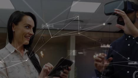 Animation-of-network-of-connections-over-businessman-using-vr-headset