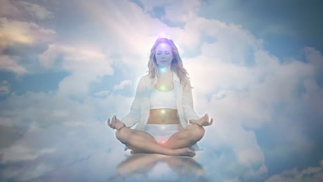 Animation-of-glowing-light-over-woman-practicing-yoga-against-clouds-and-sky
