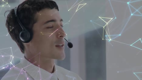 Animation-of-networks-of-connections-over-businessman-wearing-phone-headset