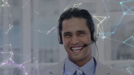 Animation-of-networks-of-connections-over-businessman-wearing-phone-headset