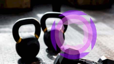 Animation-of-purple-scopes-spinning-over-kettlebells-and-weights-in-gym