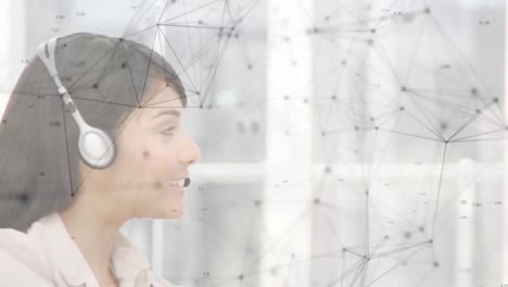 Animation-of-networks-of-connections-over-businesswoman-wearing-phone-headset