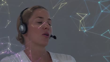 Animation-of-network-of-connections-over-businesswoman-with-headset-in-office