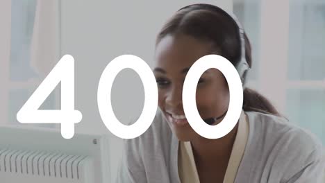Animation-of-numbers-processing-over-mixed-race-smiling-businesswoman-wearing-phone-headset