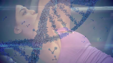 Animation-of-dna-strand-spinning-and-data-processing-over-strong-woman-exercising