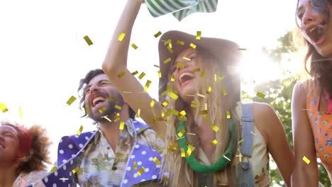 Animation-of-gold-confetti-falling-over-crowd-of-people-having-fun-at-music-concert