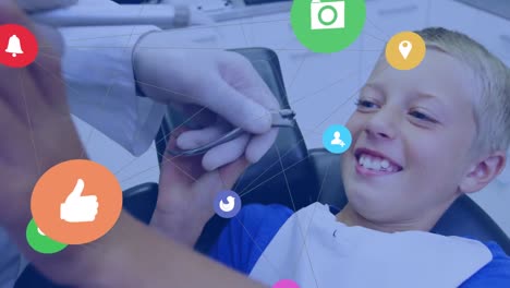 Animation-of-networks-of-connections-with-icons-over-boy-in-dentist-chair