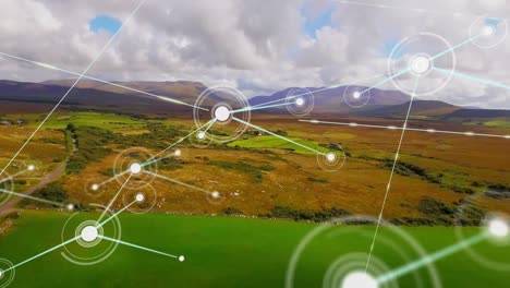 Animation-of-network-of-connections-moving-over-beautiful-countryside-landscape-and-blue-sky