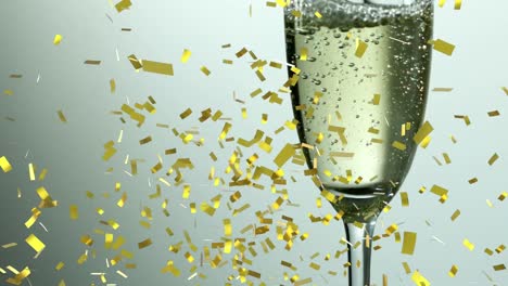 Animation-of-gold-confetti-falling-over-glass-of-champagne