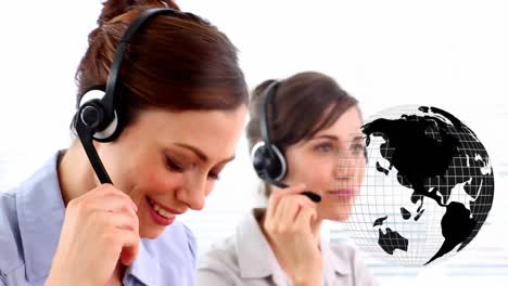 Animation-of-globe-over-business-people-wearing-headsets