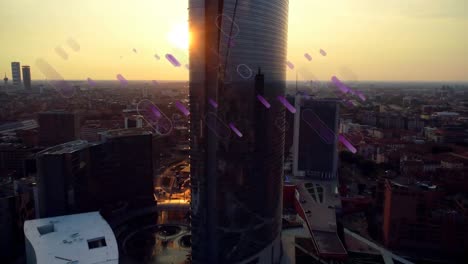 Animation-of-purple-light-flares-moving-over-city-at-sunset