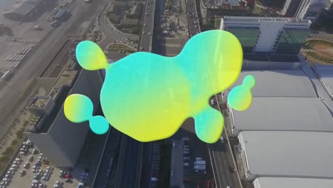 Animation-Eines-Grünen-Und-Gelben-Flecks,-Der-Sich-über-Die-Luftaufnahme-Der-Stadt-Bewegt