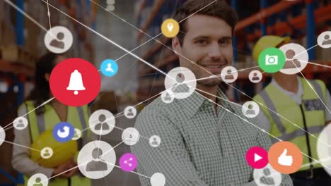 Animation-of-network-of-connections-over-smiling-man-working-in-warehouse