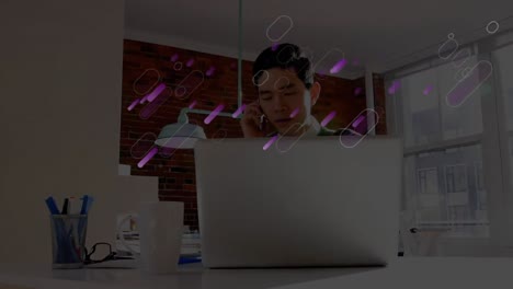 Animation-of-purple-lights-trails-over-businessman-in-office
