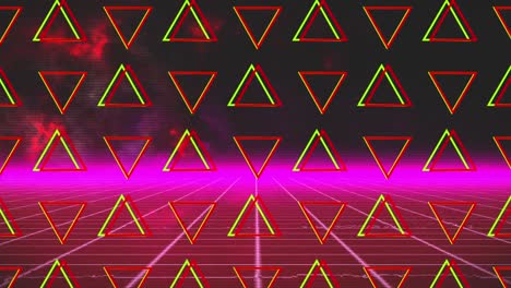 Animation-of-rotating-green-and-red-triangles-over-pink-grid-and-glowing-pink-horizon