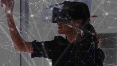 Animation-of-network-of-connections-over-businesswoman-wearing-vr-headsets