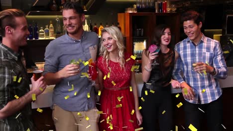 Animation-of-confetti-falling-over-happy-group-of-friends-having-fun-at-party