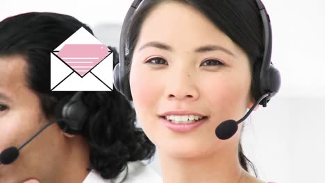 Animation-of-envelope-over-businesswoman-wearing-headset
