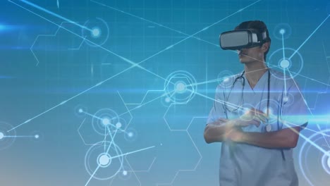 Animation-of-network-of-connections-and-data-processing-over-male-doctor-wearing-vr-headset