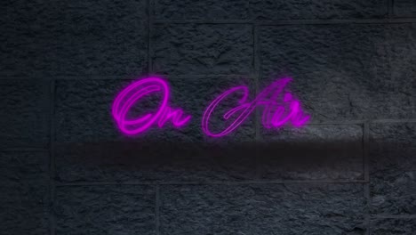 Neon-purple-on-air-text-against-black-brick-wall-in-background