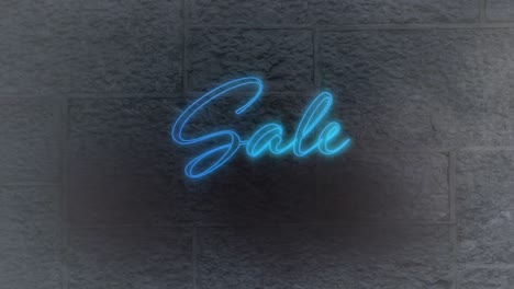 Neon-blue-sale-text-against-grey-brick-wall-in-background