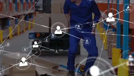 Network-of-profile-icons-against-caucasian-male-worker-falling-on-the-boxes-at-warehouse