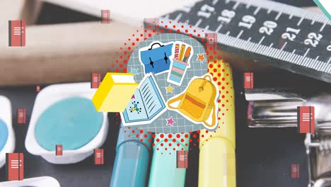 Animation-of-school-items-icons-over-desk