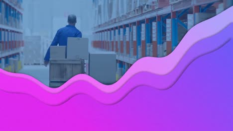 Animation-of-purple-waves-moving-over-man-working-in-warehouse