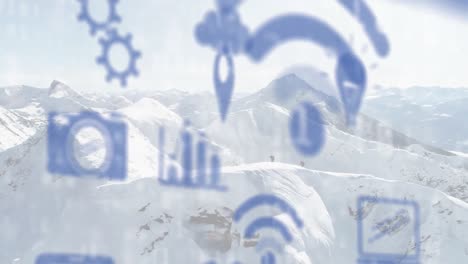 Animation-of-digital-icons-floating-over-winter-mountain-landscape
